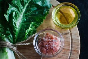 leafy kale plant with olive oil and himalayan salt